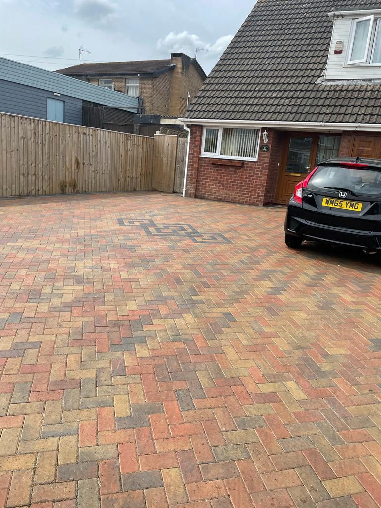 Block paved driveway outside a house