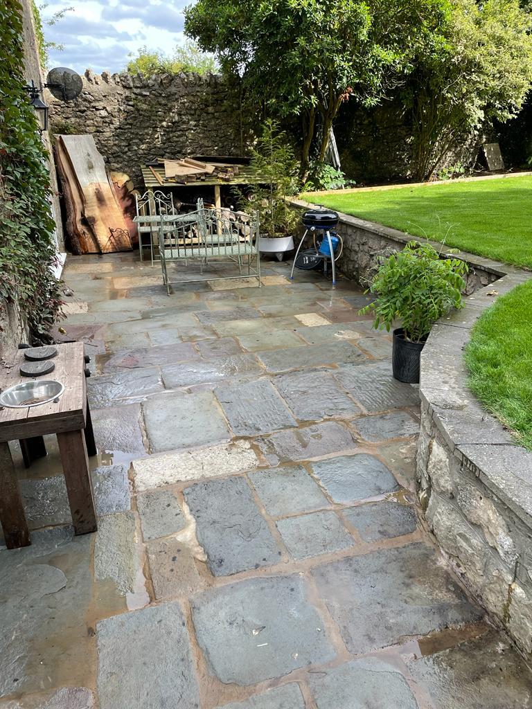 Stone terrace beside a lawn